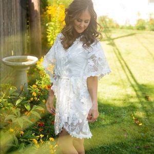 White lacy cover up with fitted white dress underneath